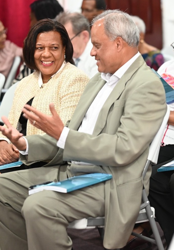 Bali Singh, Team Advisor, with CARICOM Communications Advisor Lavern Reid at book launch