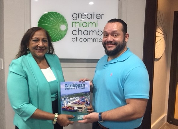Vice President of Business Development and Sales at the Greater Miami Chamber of Commerce, Maurice Gabriel Alexander, receives a copy of the business publication.