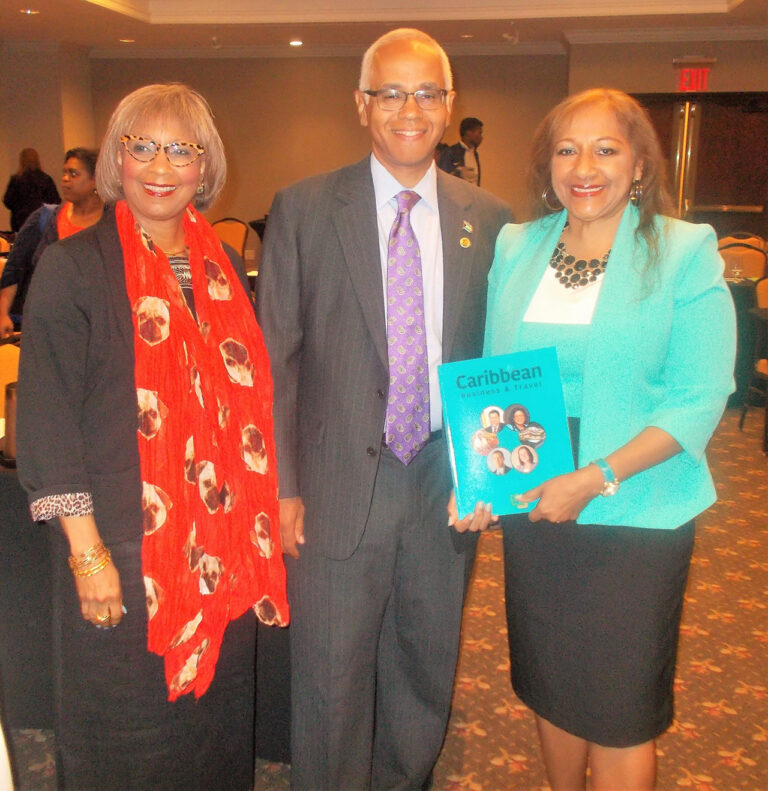 Editor of the Investment Guide, Sandra Ann Baptiste, proudly displays the publication.
