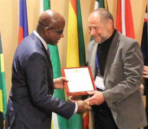 Mark's-award-from-CTO-SG Travel writer Mark Stevens receives another award from then CTO Secretary-General Hugh Riley.