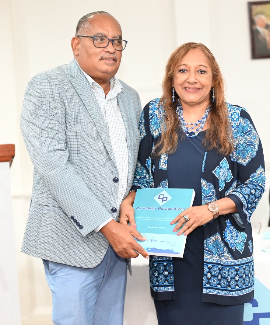 Executive Director of the World Trade Centre Georgetown (WTCG) Wesley Kirton and Sandra Ann Baptiste.